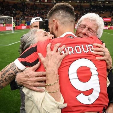 Veronique Giroud and her husband Jean-Pierre Giroud hugging their son Olivier Giroud after his game